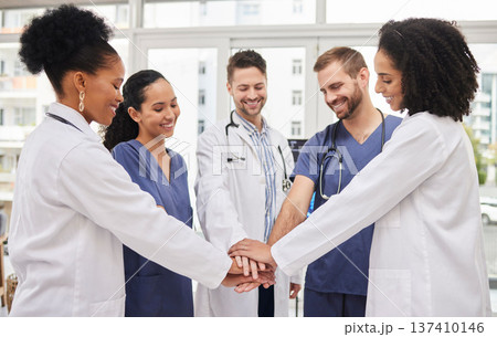 Doctors, teamwork and hands together in meeting, motivation or unity in healthcare together at hospital. Happy group of medical professionals piling in team building, support or goals at the clinic Doctors, teamwork and hands together in meeting, motivation or unity in healthcare together at hospital. Happy group of medical professionals piling in team building, support or goals at the clinic 137410146