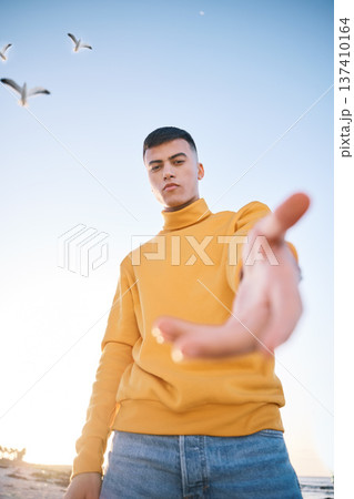 Man, hand and beach portrait for follow sign, choice and call for vacation, outdoor and adventure in nature. Gen z guy, student and open palm for decision, holiday and recruitment by ocean in summer Man, hand and beach portrait for follow sign, choice and call for vacation, outdoor and adventure in nature. Gen z guy, student and open palm for decision, holiday and recruitment by ocean in summer 137410164