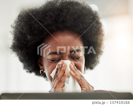 Allergies, sneeze and sick black woman blowing nose in home office with allergies, flu or cold in her home. Tissue, paper and African female freelancer with virus, hayfever or covid working on laptop Allergies, sneeze and sick black woman blowing nose in home office with allergies, flu or cold in her home. Tissue, paper and African female freelancer with virus, hayfever or covid working on laptop 137410188