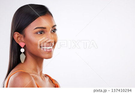 Face, beauty and Indian woman in studio for makeup, glamour and natural cosmetics on white background. Smile, glowing skin and female model with confidence, shine and pose with body care satisfaction 137410294