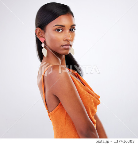 Portrait, fashion and serious woman in dress at studio isolated on a white background mockup space. Face, style and confident Indian model in formal clothes for party, event and elegant aesthetic 137410305
