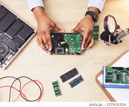 Motherboard, microchip and hands from above with electric maintenance of circuit board. Developer, IT and dashboard for electrical hardware update and technician tools for information technology 137410324