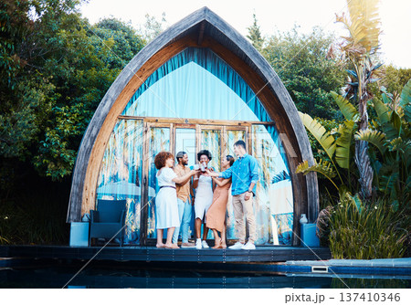 Garden lodge, glamping and friends cheers at a cabin with luxury accommodation and forest cottage. Travel, holiday and people relax at destination in Bali for vacation and freedom at resort pool 137410346