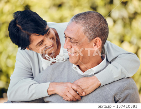 Love, smile and senior couple hug in a park with care, bond and enjoying relationship outdoor. Happy, romance and old people embrace in forest having fun with retirement, freedom or weekend in nature 137410393