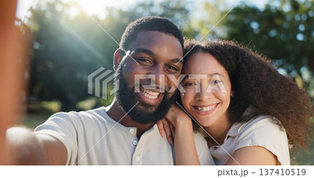 Love, selfie and face of a couple in nature on a romantic date in a garden while on a holiday. Happy, smile and portrait of African young man and woman taking picture together in park on weekend trip Love, selfie and face of a couple in nature on a romantic date in a garden while on a holiday. Happy, smile and portrait of African young man and woman taking picture together in park on weekend trip 137410519