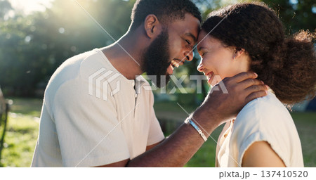 Love, nature and couple dancing with an intimate moment on a romantic date in a garden on holiday. Happy, smile and African young man and woman moving with affection in park on weekend trip together. Love, nature and couple dancing with an intimate moment on a romantic date in a garden on holiday. Happy, smile and African young man and woman moving with affection in park on weekend trip together. 137410520