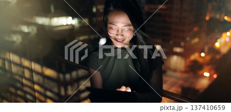 Woman, digital tablet and rooftop at night in city for social media, research and networking on urban background. Business woman, balcony and online search by entrepreneur working late in New York 137410659