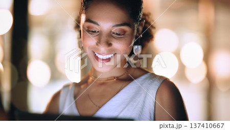 Screen, office and face of black woman at night working online, reading internet website and do research. Business, technology and female worker networking on tablet, computer or laptop in workplace Screen, office and face of black woman at night working online, reading internet website and do research. Business, technology and female worker networking on tablet, computer or laptop in workplace 137410667