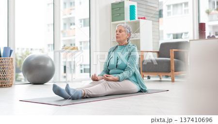 Yoga, meditation and senior woman with mindfulness and training peace, calm or home exercise for wellness. Health, spiritual and elderly person workout for zen mindset or breathing in an apartment 137410696