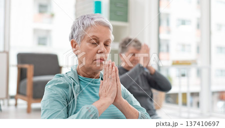 Senior people, yoga class and coach meditation, prayer and peace hands for exercise, holistic wellness and mindfulness. Spiritual workout, group and calm elderly women, clients and personal trainer 137410697