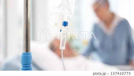 Hospital, iv drip and bag for medicine, healthcare and nutrition with couple in clinic. Intravenous liquid, water and saline solution for infusion, healing and recovery, rehabilitation and wellness 137410773