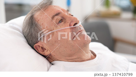 Oxygen, hospital bed and senior man with ventilation and breathing tube support in a clinic. Elderly patient, medical care and emergency room with male person at a doctor for wellness and healthcare Oxygen, hospital bed and senior man with ventilation and breathing tube support in a clinic. Elderly patient, medical care and emergency room with male person at a doctor for wellness and healthcare 137410799