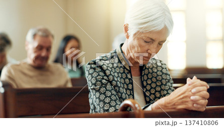 Worship, prayer or old woman in church for God, holy spirit or religion in cathedral or Christian community. Faith, spiritual or elderly person in chapel or sanctuary to praise Jesus Christ 137410806