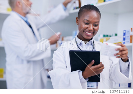 Pharmacist, woman and tablet for medicine management, reading label and stock research or inventory. Happy doctor with digital technology, healthcare box or product for pharmacy services and support Pharmacist, woman and tablet for medicine management, reading label and stock research or inventory. Happy doctor with digital technology, healthcare box or product for pharmacy services and support 137411153