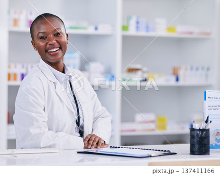 Pharmacist portrait, woman and counter for healthcare, medicine and clinic solution, services and support. Happy african person in pharmacy for drugs, medical product and inventory or retail mindset Pharmacist portrait, woman and counter for healthcare, medicine and clinic solution, services and support. Happy african person in pharmacy for drugs, medical product and inventory or retail mindset 137411166