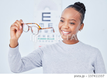 Eye care, glasses choice and patient, black woman is happy at clinic, optometry and frame with help and healthcare. Wellness, health and prescription lens, eyewear and decision with vision and smile Eye care, glasses choice and patient, black woman is happy at clinic, optometry and frame with help and healthcare. Wellness, health and prescription lens, eyewear and decision with vision and smile 137411337
