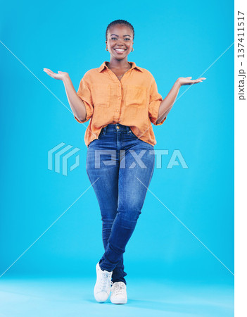 Portrait, showing and black woman with promotion, smile or opportunity on a blue studio background. Person, girl or model with happiness, decision or choice with presentation, discount deal or option Portrait, showing and black woman with promotion, smile or opportunity on a blue studio background. Person, girl or model with happiness, decision or choice with presentation, discount deal or option 137411517