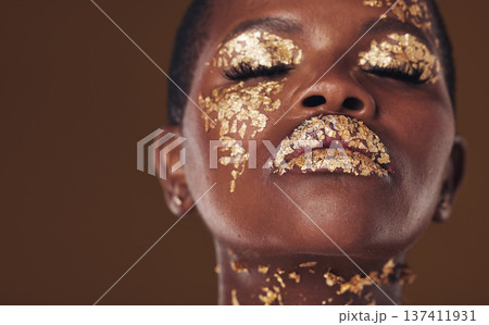 Gold, art and face of African woman with makeup for beauty aesthetics isolated in a studio brown background eyes closed. Creative, luxury and person with cosmetic glamour or design for skincare 137411931