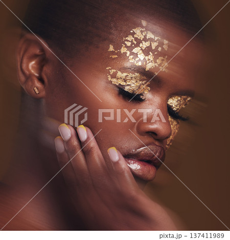 Gold beauty, blur and black woman with hand on face closeup with makeup and cosmetics in studio. Brown background, African female model and manicure with golden shine and glow from paint sparkle 137411989