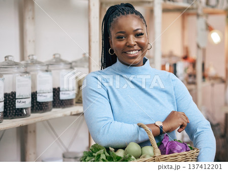 Black woman, face and shopping basket with vegetables, healthy food and diet produce in local grocery store. Smile, portrait and African customer or nutritionist in retail supermarket for fruit sales Black woman, face and shopping basket with vegetables, healthy food and diet produce in local grocery store. Smile, portrait and African customer or nutritionist in retail supermarket for fruit sales 137412201