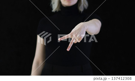 The index and middle fingers palm from the letter V, which means Victory. 137412308