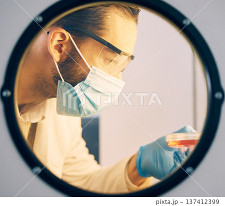 Scientist, man with incubator and research with medical study, experiment and ivf with innovation. Scientific, researcher and employee with a mask, laboratory and test sample storage with chemistry 137412399