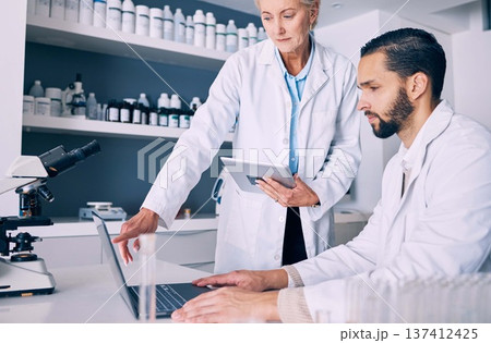 Scientist, computer and tablet for training, data analysis and laboratory report, mentor advice or pharmaceutical research. Science or medical woman and man with medicine support and digital solution 137412425