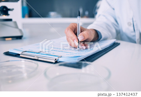 Science, hand of woman in laboratory and checklist with results, inventory list and pharmaceutical study. Research, medical notes and scientist in lab writing on clipboard, analysis and information. 137412437