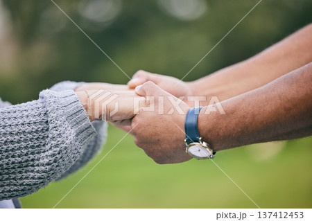 Outdoor, closeup and couple holding hands, love or support with comfort, romance or trust. People, man or woman outside, lovers or care with bonding, romantic or marriage with relationship or loyalty Outdoor, closeup and couple holding hands, love or support with comfort, romance or trust. People, man or woman outside, lovers or care with bonding, romantic or marriage with relationship or loyalty 137412453