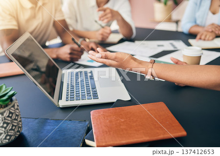 Meeting, hands of business people with laptop and paperwork for training, motivation and collaboration. Teamwork, men and women at office desk with computer, documents and brainstorming at workshop. Meeting, hands of business people with laptop and paperwork for training, motivation and collaboration. Teamwork, men and women at office desk with computer, documents and brainstorming at workshop. 137412653