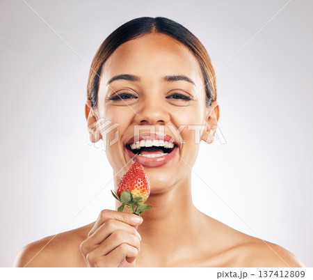 Skincare, portrait and happy woman with strawberry in studio for wellness or natural cosmetics on white background. Beauty, face and female smile with fruit for antioxidants or anti aging wellness Skincare, portrait and happy woman with strawberry in studio for wellness or natural cosmetics on white background. Beauty, face and female smile with fruit for antioxidants or anti aging wellness 137412809