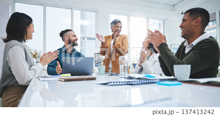 Excited team in business meeting with applause, cheers and celebration of sales target achievement at desk. Clapping, praise and congratulations with success, motivation for men and women in office. 137413242