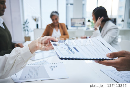 Hands, documents or business people in meeting for feedback or performance review paperwork. Team report, planning sales logistics or manager giving portfolio or data analytics to employee in office Hands, documents or business people in meeting for feedback or performance review paperwork. Team report, planning sales logistics or manager giving portfolio or data analytics to employee in office 137413255