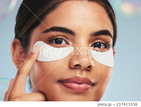 Eye patch, portrait and face of woman for beauty, dermatology and aesthetic skincare on studio background with bubbles. Model, self care and cosmetics for eyes, facial collagen and anti aging product Eye patch, portrait and face of woman for beauty, dermatology and aesthetic skincare on studio background with bubbles. Model, self care and cosmetics for eyes, facial collagen and anti aging product 137413336