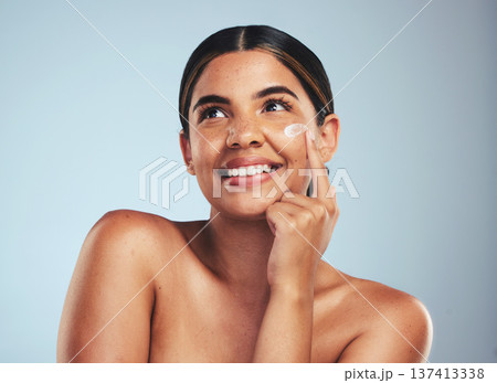 Face, cosmetics cream and portrait of woman with aesthetic shine, dermatology and skincare makeup on studio background. Happy model thinking of facial sunscreen lotion for self care, beauty and glow 137413338