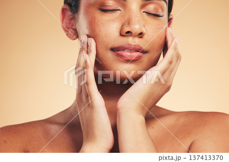 Skincare, beauty and natural face of woman with hands for wellness, health and facial care in studio. Dermatology, spa and eyes closed of person on brown background in cosmetics, glow or satisfaction Skincare, beauty and natural face of woman with hands for wellness, health and facial care in studio. Dermatology, spa and eyes closed of person on brown background in cosmetics, glow or satisfaction 137413370