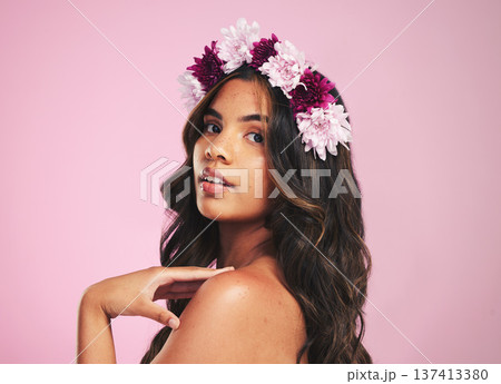 Woman, flowers and portrait of crown in studio for beauty, natural skincare and spring plants on pink background. Face, model and floral wreath for sustainable cosmetics, eco dermatology or hair care Woman, flowers and portrait of crown in studio for beauty, natural skincare and spring plants on pink background. Face, model and floral wreath for sustainable cosmetics, eco dermatology or hair care 137413380