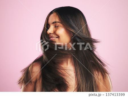 Hair care, smile and woman shaking head in studio, luxury salon treatment and shine with texture. Healthy haircare wellness, beauty aesthetic and cosmetics, happy girl with glow and pink background. 137413399