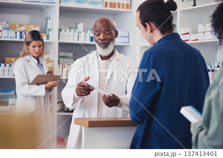 Pharmacy, customer or mature pharmacist explain prescription paper, medicine information or healthcare receipt. Store clinic, hospital conversation or black man consulting patient over medical choice Pharmacy, customer or mature pharmacist explain prescription paper, medicine information or healthcare receipt. Store clinic, hospital conversation or black man consulting patient over medical choice 137413401