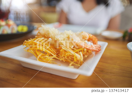 Food, sushi and cuisine on a table in a restaurant for a traditional asian dish or meal closeup. Seafood, fine dining and shrimp tempura on a plate in a chinese eatery for hunger or nutrition 137413417