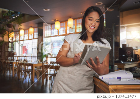Restaurant, coffee shop and woman online on tablet for food service, inventory and check menu. Fine dining, small business and happy waitress, barista or manager on digital tech for cafe website Restaurant, coffee shop and woman online on tablet for food service, inventory and check menu. Fine dining, small business and happy waitress, barista or manager on digital tech for cafe website 137413477