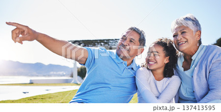 Happy, talking or grandparents with child in nature bonding to relax with care in retirement on mockup space. Smile, grandmother or senior grandfather pointing with a kid on holiday in summer park 137413595