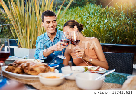 Smile, couple and toast with wine glass at restaurant, bonding and having fun. Happy, alcohol and man and woman cheers at dinner party, celebration date and drink together at outdoor table with food Smile, couple and toast with wine glass at restaurant, bonding and having fun. Happy, alcohol and man and woman cheers at dinner party, celebration date and drink together at outdoor table with food 137413621