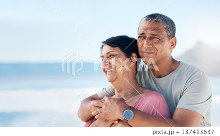 Happy, mature couple and hug outdoor at beach with a smile, care and happiness together. Man and woman thinking of healthy marriage, commitment and freedom on a travel holiday with space in sky Happy, mature couple and hug outdoor at beach with a smile, care and happiness together. Man and woman thinking of healthy marriage, commitment and freedom on a travel holiday with space in sky 137413637