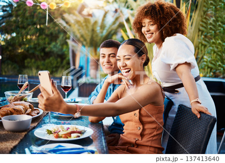 Friends, food and selfie at outdoor table for holiday, Christmas or thanksgiving on social media. Young women, man or group with photography or influencer profile picture for happy brunch celebration Friends, food and selfie at outdoor table for holiday, Christmas or thanksgiving on social media. Young women, man or group with photography or influencer profile picture for happy brunch celebration 137413640