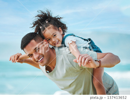 Piggy back, portrait and father with girl, travel and vacation with energy, summer break and playful together. Happy family, dad carrying female child and kid with seaside holiday, smile or adventure Piggy back, portrait and father with girl, travel and vacation with energy, summer break and playful together. Happy family, dad carrying female child and kid with seaside holiday, smile or adventure 137413652