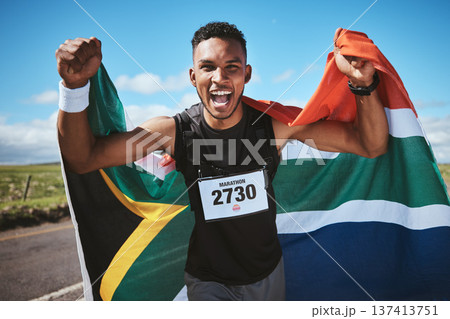 Portrait, exercise and flag of South Africa with a man runner on a street in nature for motivation or success. Fitness, winner and health with an athlete cheering during cardio or endurance training 137413751