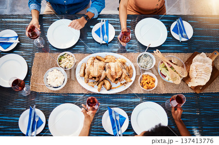 Wine, food or top of friends in restaurant to relax on holiday vacation at a party event together. Food, group celebration or hands of people eating chicken at table for lunch, dinner or brunch meal 137413776