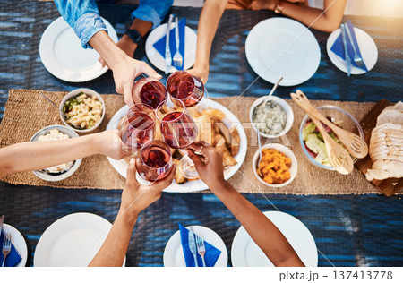 Toast, food or top of friends in restaurant to relax on holiday vacation at a party event together. Cheers, group celebration or hands of fun people eating at table for lunch, dinner or brunch meal Toast, food or top of friends in restaurant to relax on holiday vacation at a party event together. Cheers, group celebration or hands of fun people eating at table for lunch, dinner or brunch meal 137413778