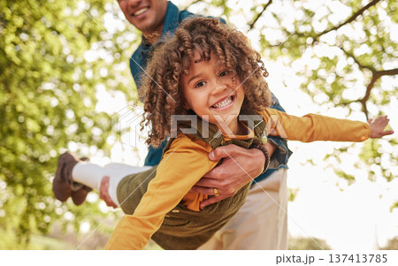 Father, child and plan game in park, outdoor or nature on holiday, freedom or care with bonding. Excited young kid, dad and swing for airplane, fast and free for play on vacation in backyard by trees 137413785